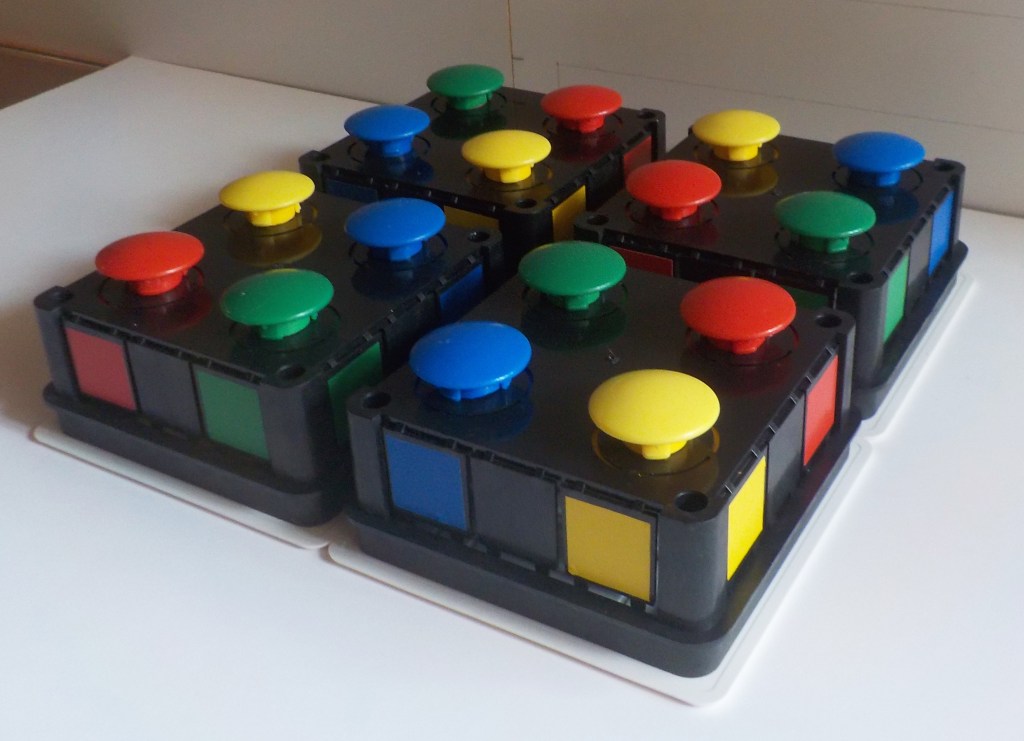 cheerful start buttons in four different colors in a harmonious arrangement. To expose the deception related to nuclear weapons